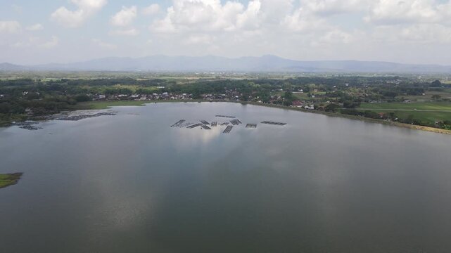 Aerial view of Mulur Reservoir, a natural tourist destination and reservoir, a Dutch heritage site built in 1926 in Sukoharjo, Central Java, Indonesia.