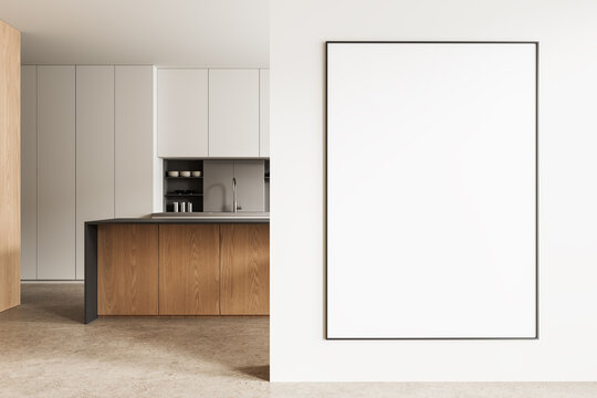 Modern minimal interior kitchen with wooden cabinetry beside large vertical empty frame on light wall in contemporary home design. 3D Rendering