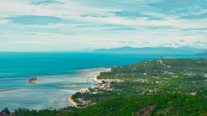 Obraz premium Samui Thailand - 27 June 2026 : Seascape Seen from Overlap Stone is located in Samui island Thailand - Famous check point in Samui island - Blue Nature Abstract background. This was on a hot sunny d