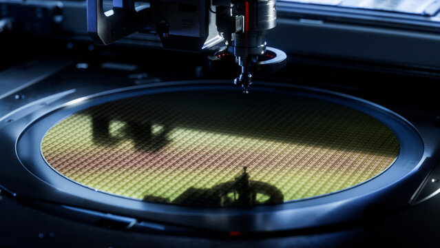 Semiconductor Wafer Inside Pick and Place Machine before Silicon Chip Extraction Process. Computer Chip Packaging Process. Microchip Manufacturing at a Factory.