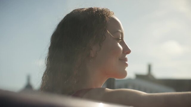 The woman settles into a luxury hot tub for a sunny outdoor wellness pause