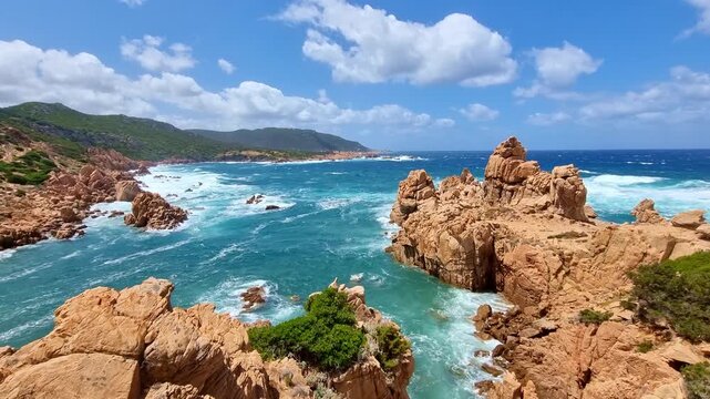 Beautiful turquoise sea with amazing waves and rock formations at Li Cossi beach, in sunny summer day, in Sardinia, Italy