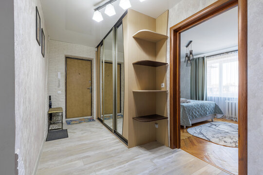Apartment Hallway Interior with View into Cozy Bedroom