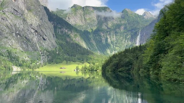 Panoramic, scenic view of Obersee Lake. Mountains and Rothbach waterfall in the background. Chrystal clear water. Obersee, Bavaria, Germany