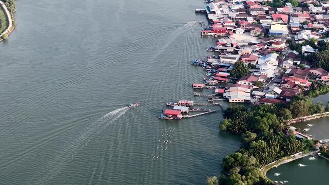 Aerial view of fishing boats returning to Sungai Udang jetty