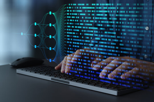 Big data analytics using neural networks and machine learning algorithms. Data scientist performing data mining on desktop computer.