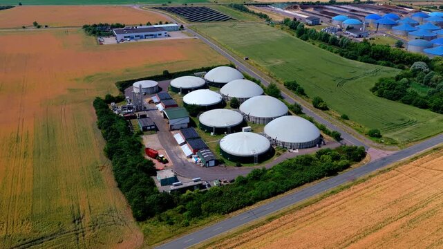 Drone Aerial Video of Biogas Plant with White Domes and Solar Arrays