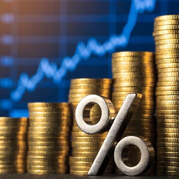 A silver percentage symbol and ascending stacks of golden coins against a blurred upward-trending financial graph, representing investment growth, interest rates, and economic success.