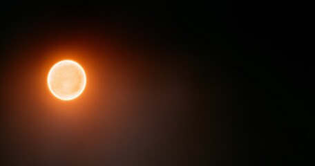 Obraz premium Glowing orange celestial body in space
