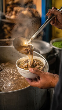 Hand serving steaming Coto Makassar soup from large pot with ladle.generative AI