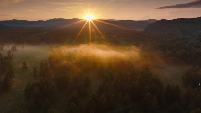 Sunrise Over Mountainous Forest With Mist