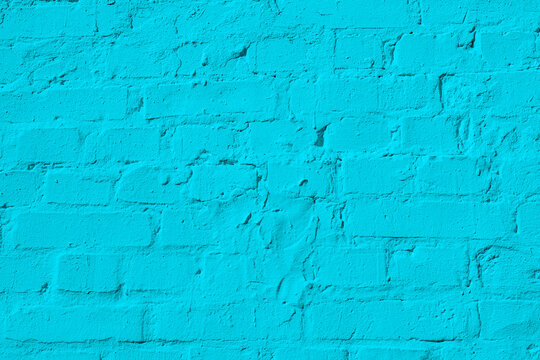 Bright blue painted brick wall surface texture