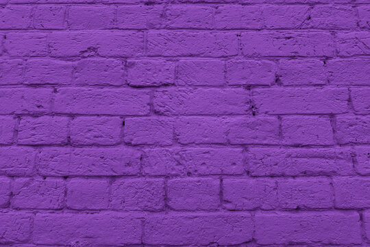 Purple painted brick wall texture with visible mortar lines