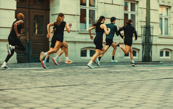 The city becomes a backdrop as running unites a group outdoors