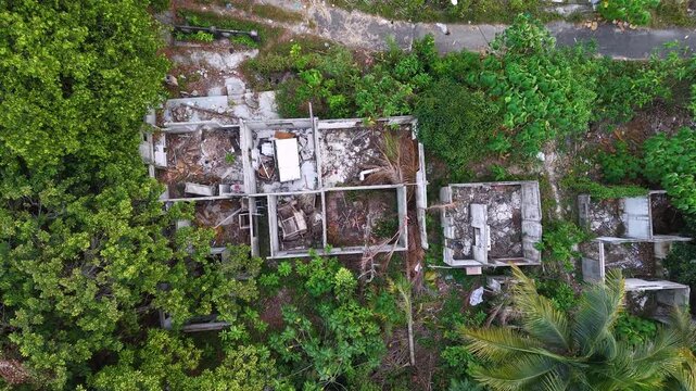Aerial drone view of demolished house ruins