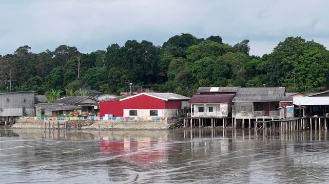 Segenting Coastal Village Stilt Houses Evening Reflection