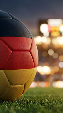 Soccer ball featuring the german flag design on a stadium field, football