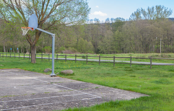 Solitary basketball court on the outskirts of a village