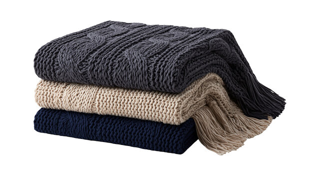 Stack of three chunky knit blankets in dark gray beige, and navy blue