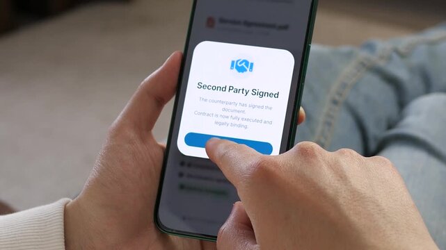 Person confirming a successful digital signature on a mobile app. Great for productivity tools, paperless office ads, and modern on-the-go workforce promotions.