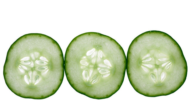 Three fresh cucumber slices with visible seeds and green skin