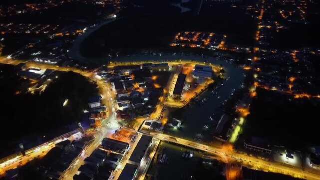 Night aerial view captures vibrant city lights