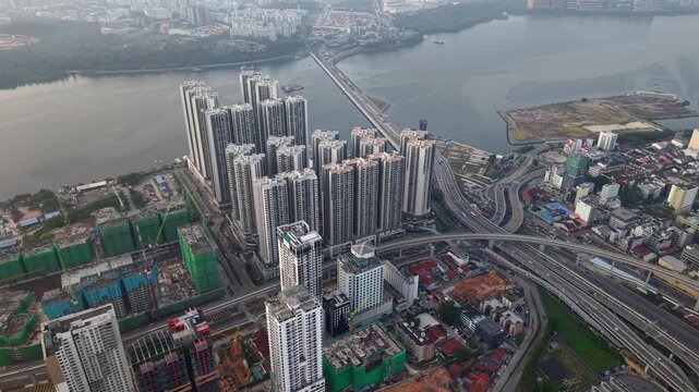 Tall residential buildings line the riverbank