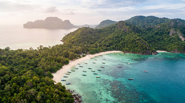 Aerial View of Thai Tropical Coastline with Turquoise Sea, White Sand Beach and Longtail Boats on Crystal Water, Limestone Island