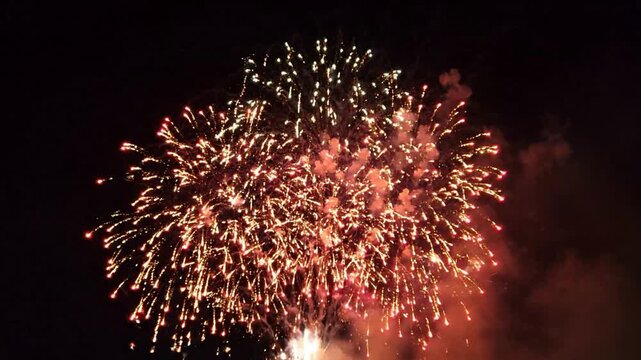 Vibrant multi-colored fireworks display exploding in night sky for celebration and festive events pyrotechnics