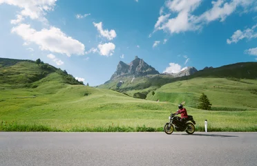 Motorcyclist riding on alpine mounain road in the Alps in summer © JFL Photography