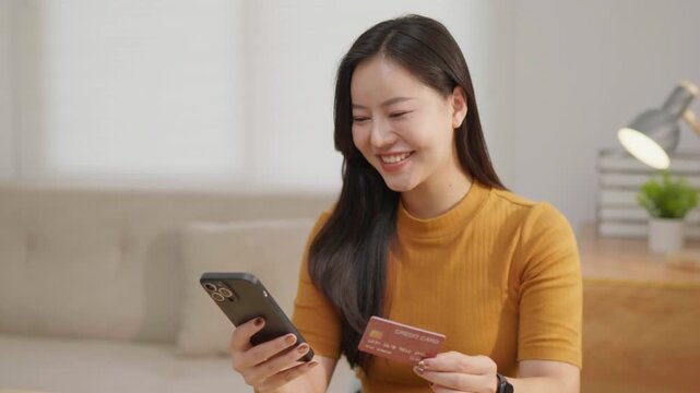 Woman using a smartphone at home, ideal for mobile app, online communication, social media, digital lifestyle, messaging and technology concepts.