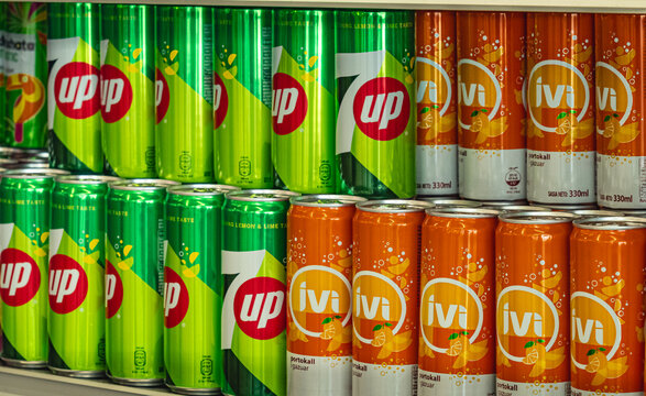 Supermarket shelf with Pepsi 7up fizzy lemon and IVI soda drink
