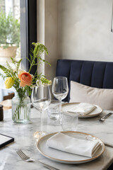 Fototapeta premium Sophisticated dining table setup at a trendy restaurant with city view restaurant interior