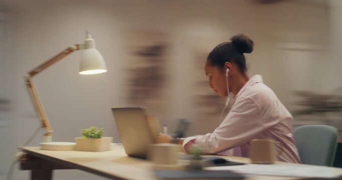 360 Degree Timelapse. Young Black Woman Studying at Home Desk, Typing on Laptop Computer, Checking Smartphone and Drinking Coffee While Enjoying Music Through Earphones. Cinematic Arc Tracking Shot.