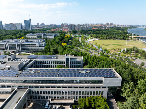 Shouguang modern buildings with solar photovoltaic panels installed on rooftops in panoramic view