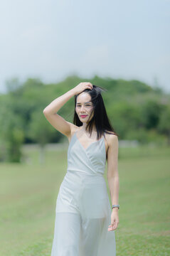 Elegant Woman in White Outfit Enjoys Scenic View in Khao Yai, Thailand