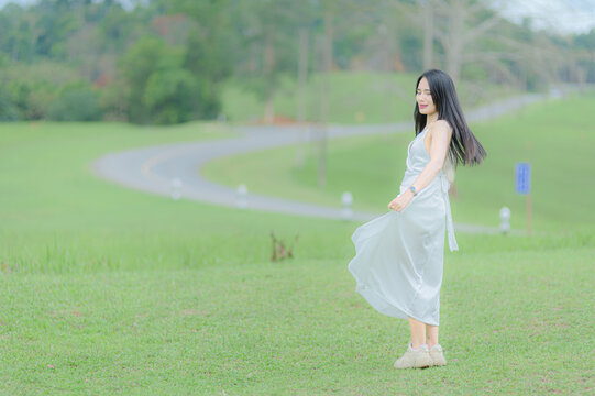 Young Woman in White Outfit Enjoying Nature in Khao Yai Thailand