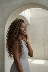 Fototapeta premium Warm chocolate brown hair woman with long voluminous curls portrait