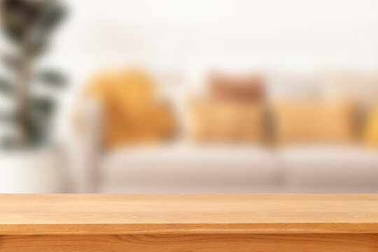 Wooden table in cozy livingroom backdrop