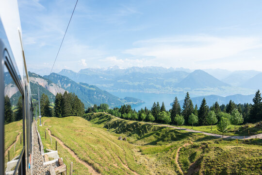 Cogwheel train moving through rigi mountain landscape switzerland