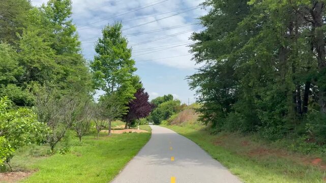 Biking along Swamp Rabbit Trail on the way from Greenville to Travelers Rest in South Carolina