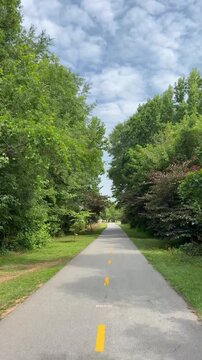 Biking along multi use Swamp Rabbit Trail on the way from Greenville to Travelers Rest in South Carolina
