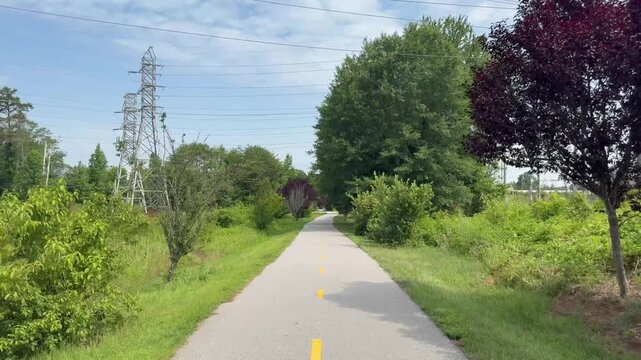 Biking along the popular Swamp Rabbit Trail on the way from Greenville to Travelers Rest in South Carolina