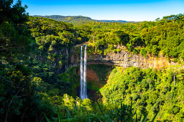 The famous twin cascades of Chamarel in the south of Mauritius. Tallest waterfalls of the tropical island (Indian Ocean). Popular touristic sight and natural wonder seen from an elevated view point. © ON-Photography