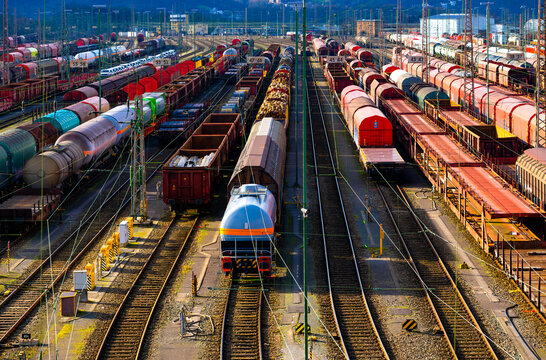 The freight station in Hagen-Vorhalle is one of the largest facilities of its kind in Europe. Here, trains are divided and reassembled on countless parallel tracks. Panorama with colourful wagons.