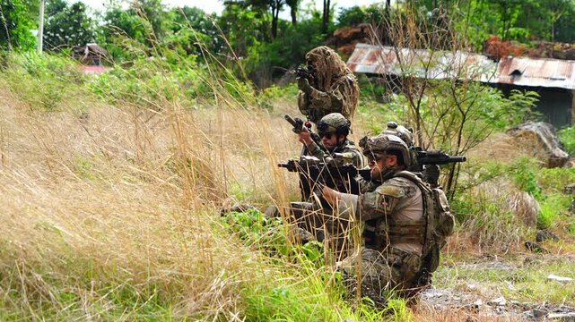 A group of soldiers from various nations, armed with BB guns, held a meeting, conducted drills, and played games.
