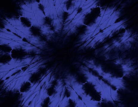 Batik fabric. A dark blue tie-dye pattern radiates outwards from a black center. The pattern resembles a starburst or a dark flower.