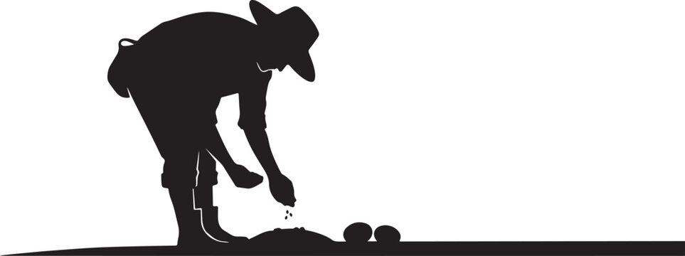 Silhouette of a man in a hat bending over to pick up balls