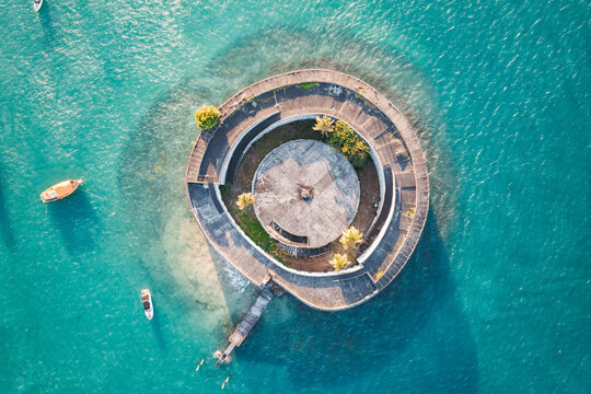 Aerial view of the round Forte de Sao Marcelo sea fort in turquoise water, Salvador, Bahia, Brazil