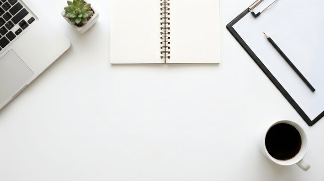 Laptop notebook clipboard and coffee cup on a clean desk workspace
